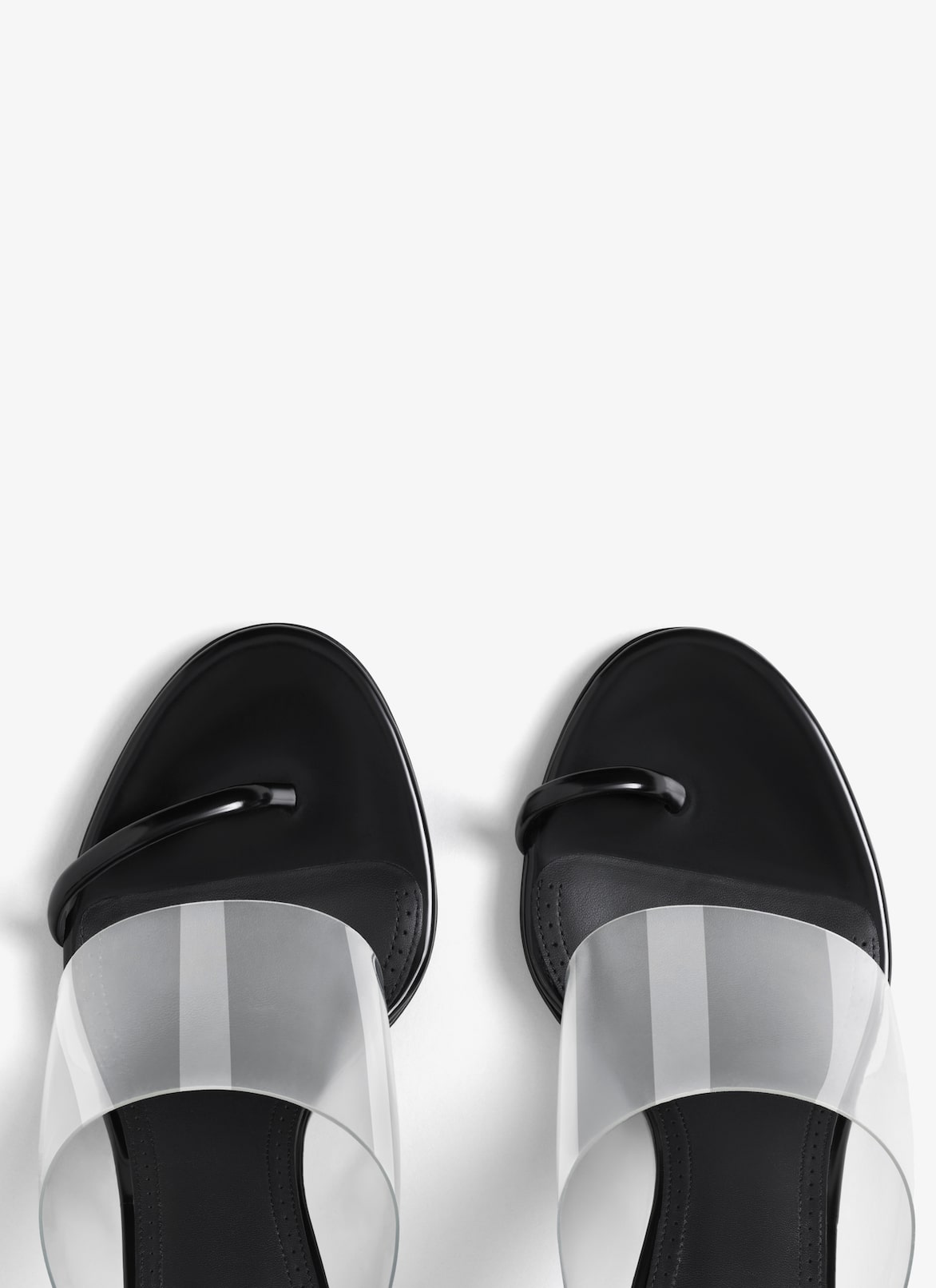 ASYMMETRIC SANDALS IN LEATHER ALAÏA BLACK ASYMMETRIC SANDALS IN LEATHER